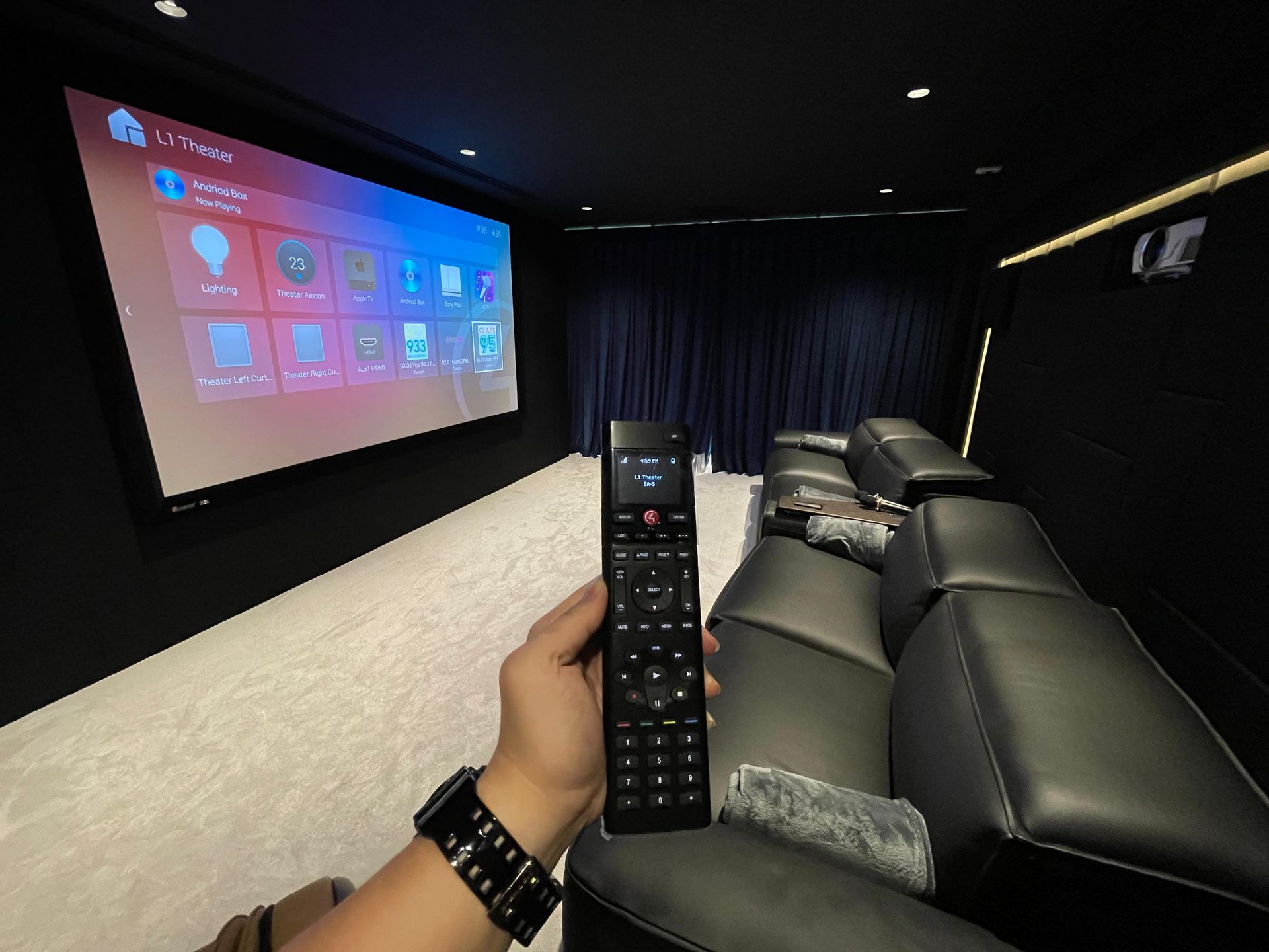 Control4 handheld smart remote and interface controlling luxury residence media and scenes